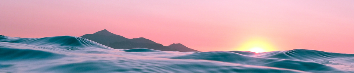 Pink sky behind mountains